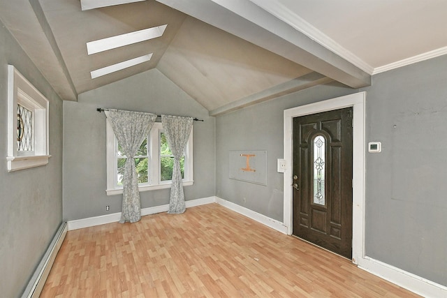 426 Lakeview Rd, Bellmore, NY 11710 - entryway featuring baseboard heating, a skylight, wood finished floors, baseboards, and vaulted ceiling