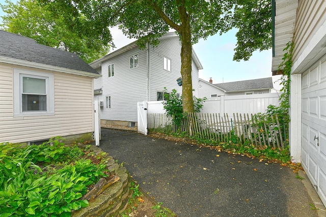 426 Lakeview Rd, Bellmore, NY 11710 - view of side of property with a garage
