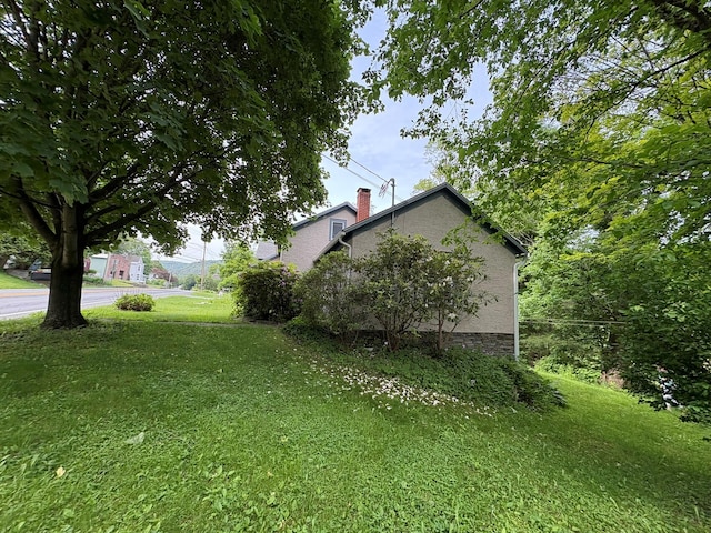 13 Rockland Rd, Roscoe, NY 12776 - view of side of home with a yard and a chimney