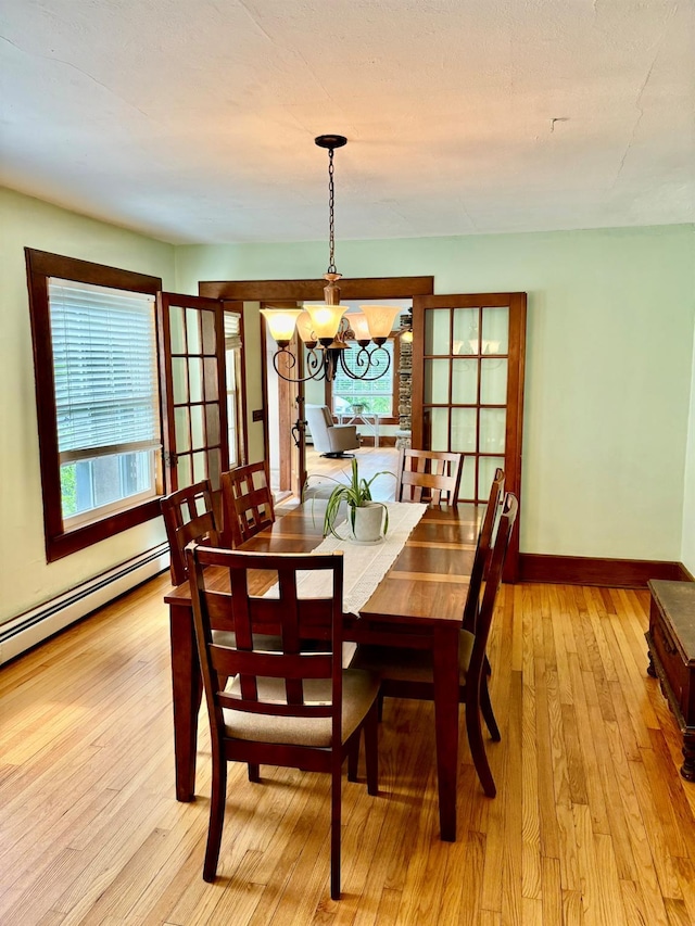 13 Rockland Rd, Roscoe, NY 12776 - dining area featuring healthy amount of natural light, light wood-type flooring, and a chandelier