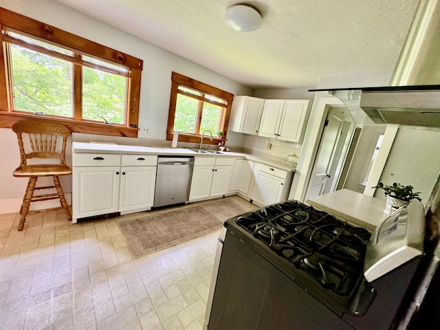 13 Rockland Rd, Roscoe, NY 12776 - kitchen featuring dishwasher, black range with gas stovetop, light countertops, and white cabinets