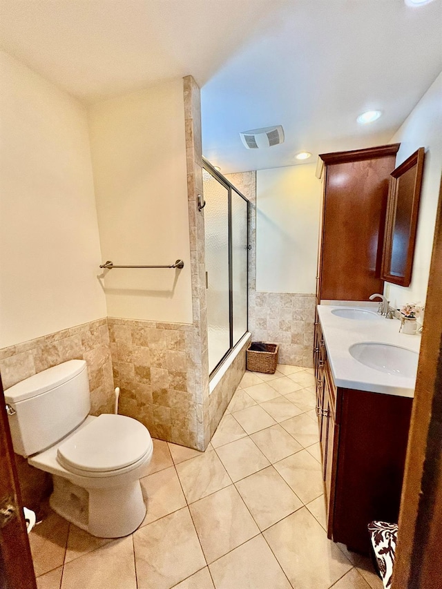 13 Rockland Rd, Roscoe, NY 12776 - full bathroom featuring tile walls, a tile shower, a wainscoted wall, tile patterned flooring, and double vanity
