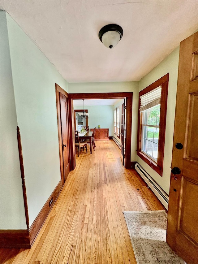 13 Rockland Rd, Roscoe, NY 12776 - corridor with baseboard heating, light wood-type flooring, and a baseboard heating unit