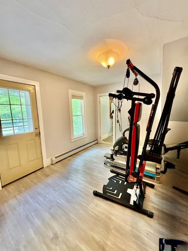 13 Rockland Rd, Roscoe, NY 12776 - workout area with a baseboard radiator and wood finished floors