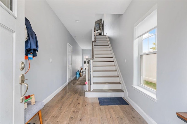 24 Hearthstone Ct Unit 24, Farmingdale, NY 11735 - foyer entrance featuring wood finished floors, plenty of natural light, stairway, and recessed lighting