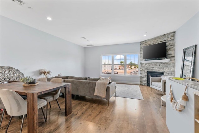 24 Hearthstone Ct Unit 24, Farmingdale, NY 11735 - living area featuring a fireplace and wood finished floors