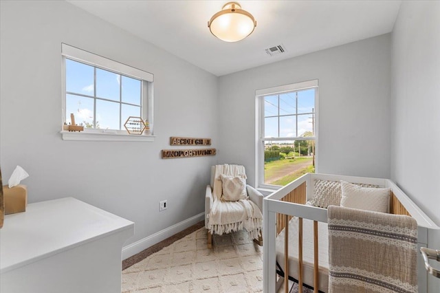24 Hearthstone Ct Unit 24, Farmingdale, NY 11735 - bedroom featuring baseboards and a crib