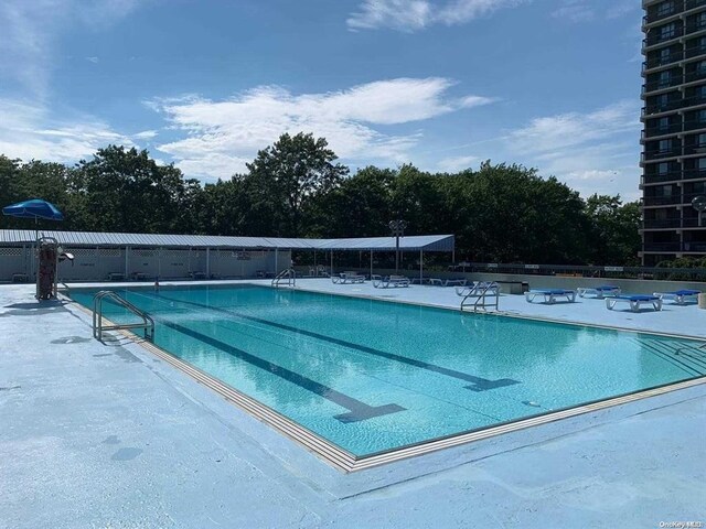 152-18 Union Tpke Unit 9P, Flushing, NY 11367 - community pool featuring a patio