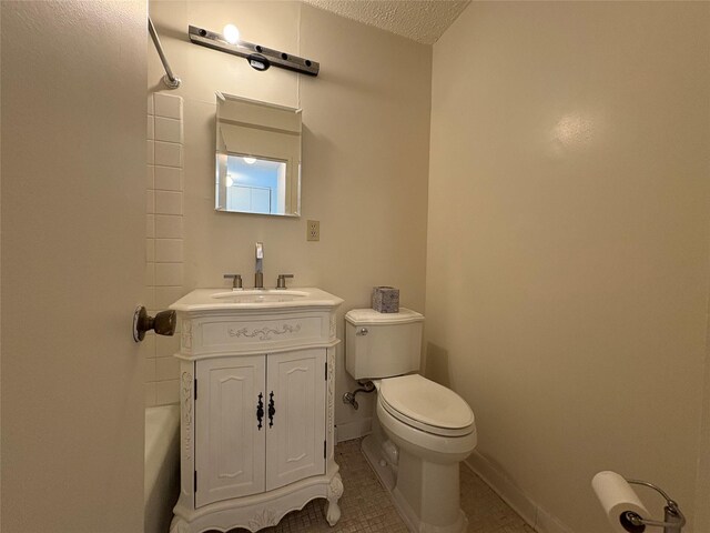 152-18 Union Tpke Unit 9P, Flushing, NY 11367 - bathroom featuring toilet, vanity,  shower combination, tile patterned floors, and a textured ceiling