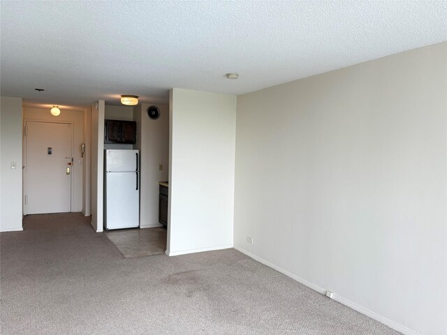152-18 Union Tpke Unit 9P, Flushing, NY 11367 - carpeted spare room with a textured ceiling, a smoke detector, and baseboards