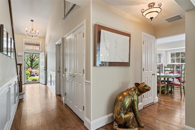 81 Hidden Ridge Dr, Syosset, NY 11791 - entryway with a chandelier and wood finished floors