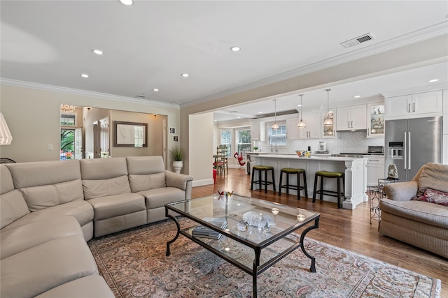 81 Hidden Ridge Dr, Syosset, NY 11791 - living area with recessed lighting, dark wood-type flooring, and ornamental molding