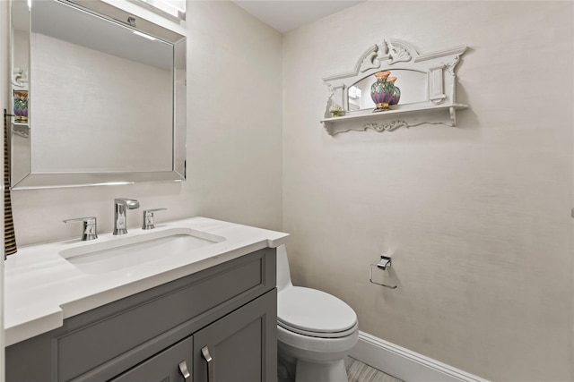 81 Hidden Ridge Dr, Syosset, NY 11791 - half bathroom featuring vanity and toilet