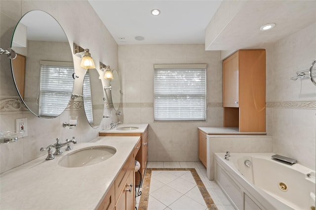 81 Hidden Ridge Dr, Syosset, NY 11791 - bathroom featuring vanity, a tub with jets, tile walls, and tile patterned flooring