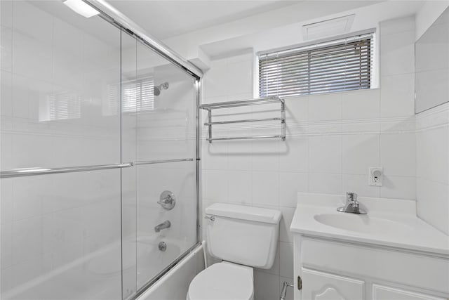 81 Hidden Ridge Dr, Syosset, NY 11791 - bathroom featuring enclosed tub / shower combo, vanity, and tile walls