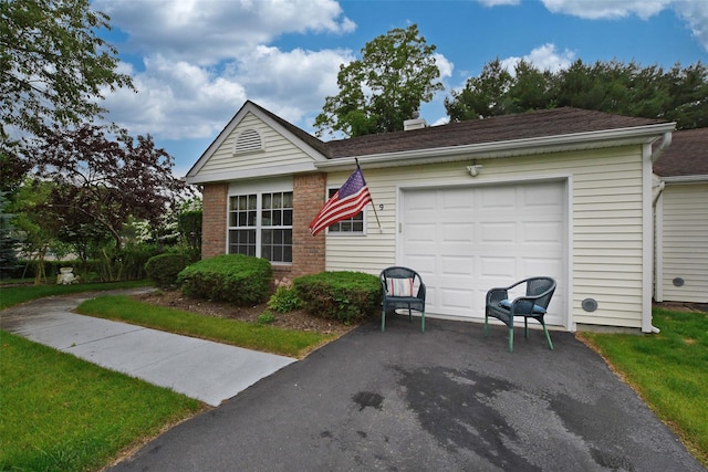 9 Quail Path, Coram, NY 11727 - view of front of home with asphalt driveway, a chimney, a garage, and roof with shingles