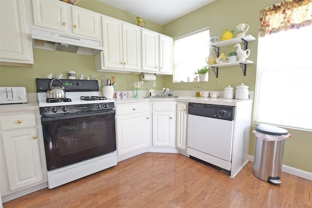 9 Quail Path, Coram, NY 11727 - kitchen featuring white appliances, under cabinet range hood, light countertops, white cabinets, and light wood-style flooring