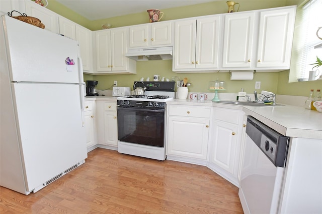 9 Quail Path, Coram, NY 11727 - kitchen featuring white appliances, under cabinet range hood, a sink, light wood-type flooring, and white cabinetry