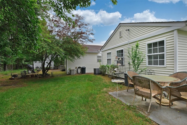 9 Quail Path, Coram, NY 11727 - view of grassy yard featuring a patio and central AC unit