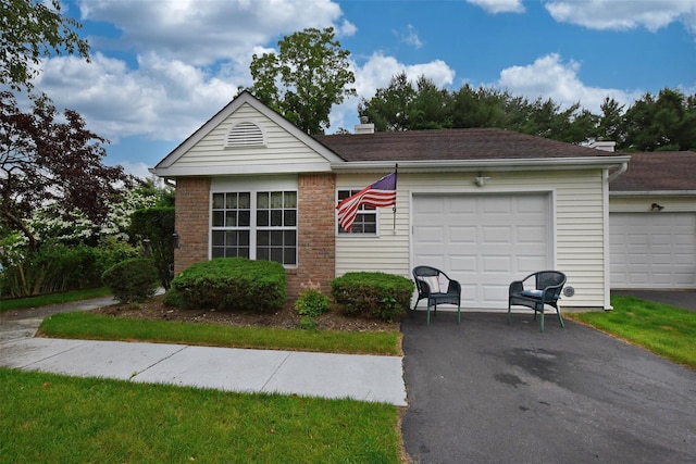 9 Quail Path, Coram, NY 11727 - ranch-style home featuring driveway, a chimney, and an attached garage