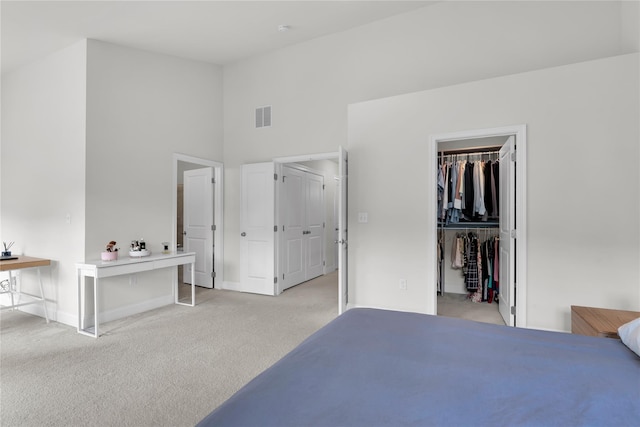 20 Dennis Ln, Pleasantville, NY 10570 - bedroom featuring light colored carpet, high vaulted ceiling, a walk in closet, and a closet
