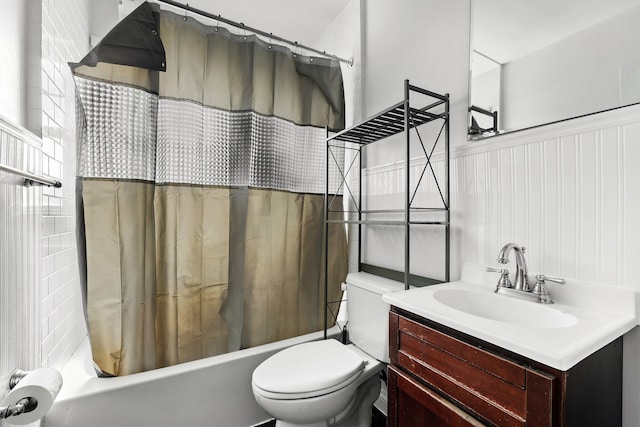 305 Columbus Ave, Harrison, NY 10604 - bathroom featuring shower / tub combo with curtain, vanity, and wainscoting