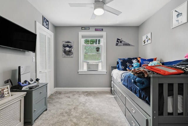 305 Columbus Ave, Harrison, NY 10604 - bedroom with light colored carpet, a closet, cooling unit, and a ceiling fan