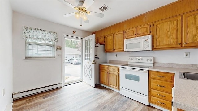 377C Woodbridge Dr, Ridge, NY 11961 - kitchen with white appliances, a baseboard heating unit, light countertops, light wood-style floors, and a ceiling fan