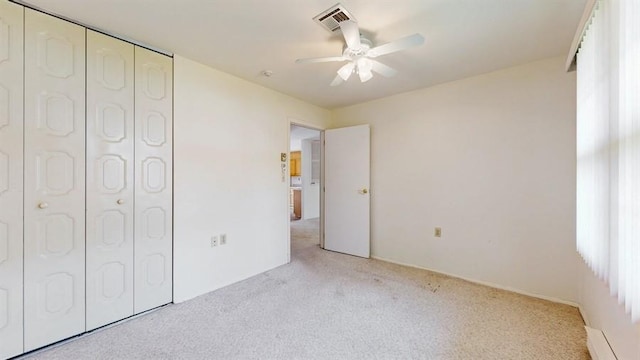 377C Woodbridge Dr, Ridge, NY 11961 - unfurnished bedroom with light carpet, a closet, and ceiling fan