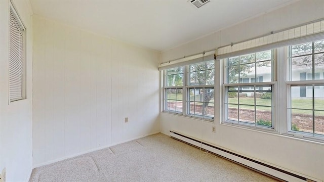 377C Woodbridge Dr, Ridge, NY 11961 - unfurnished sunroom featuring a baseboard radiator and healthy amount of natural light