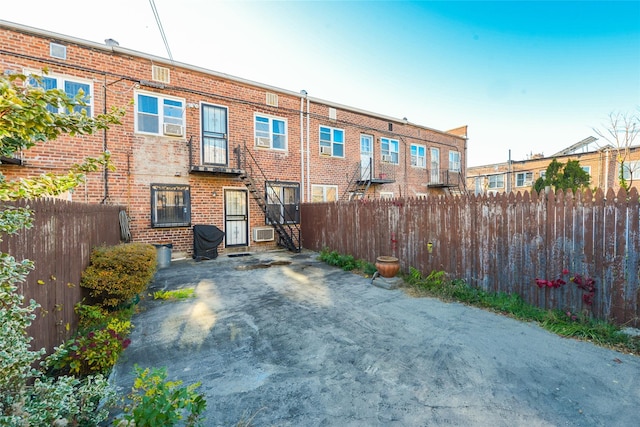 1319 E 86th St, Brooklyn, NY 11236 - back of property with brick siding and cooling unit