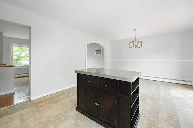 15 Pond St, Poughkeepsie, NY 12603 - kitchen featuring baseboard heating, arched walkways, a wall unit AC, and light countertops
