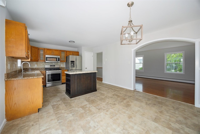 15 Pond St, Poughkeepsie, NY 12603 - kitchen featuring stainless steel appliances, baseboard heating, a sink, a kitchen island, and a chandelier