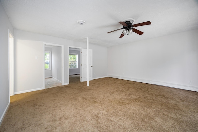 15 Pond St, Poughkeepsie, NY 12603 - spare room featuring light colored carpet, ceiling fan, baseboards, and a smoke detector
