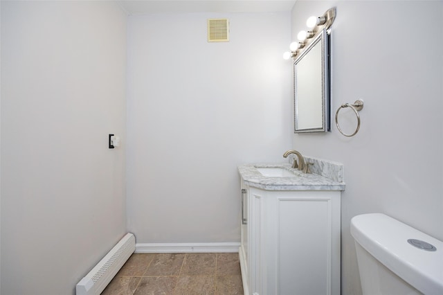 15 Pond St, Poughkeepsie, NY 12603 - bathroom featuring baseboard heating, vanity, baseboards, and toilet