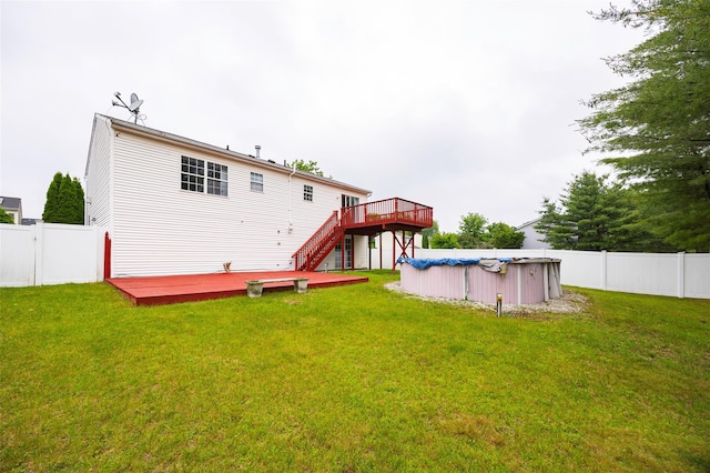 15 Pond St, Poughkeepsie, NY 12603 - rear view of house featuring a wooden deck and stairway