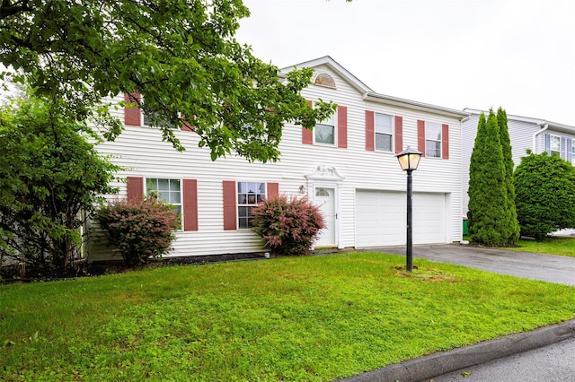 15 Pond St, Poughkeepsie, NY 12603 - colonial inspired home with driveway, an attached garage, and a front lawn