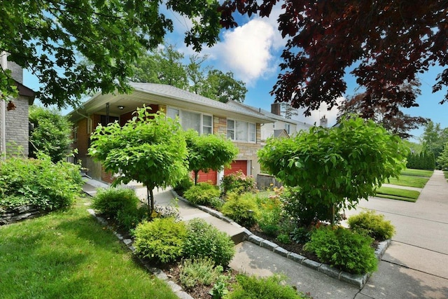 8519 212th St, Hollis Hills, NY 11427 - view of front of house featuring stone siding