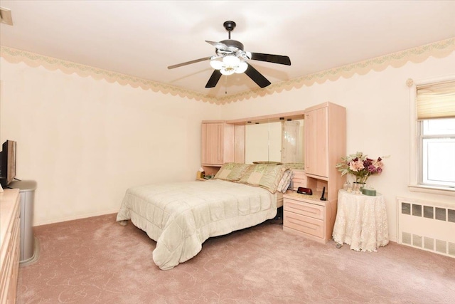 8519 212th St, Hollis Hills, NY 11427 - bedroom featuring radiator heating unit, light carpet, and ceiling fan