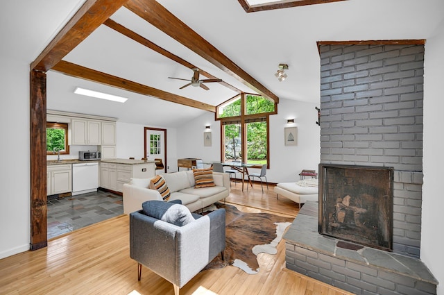 39 Cliff Rd, Greenwood Lake, NY 10925 - living room with a fireplace, healthy amount of natural light, wood finished floors, and a ceiling fan