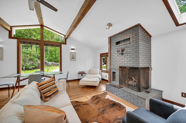 39 Cliff Rd, Greenwood Lake, NY 10925 - living room featuring a brick fireplace, wood finished floors, and a ceiling fan