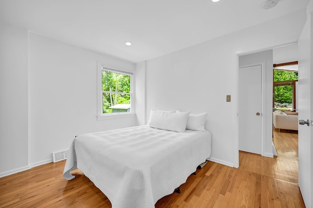 39 Cliff Rd, Greenwood Lake, NY 10925 - bedroom with multiple windows, light wood-type flooring, and recessed lighting