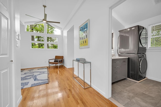 39 Cliff Rd, Greenwood Lake, NY 10925 - laundry area with stacked washing machine and dryer, a ceiling fan, and light wood finished floors