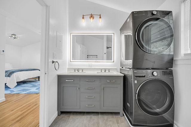 39 Cliff Rd, Greenwood Lake, NY 10925 - laundry room featuring stacked washer / dryer and baseboards