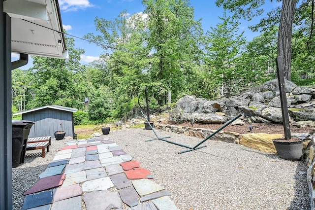 39 Cliff Rd, Greenwood Lake, NY 10925 - view of patio / terrace with a shed and view of scattered trees