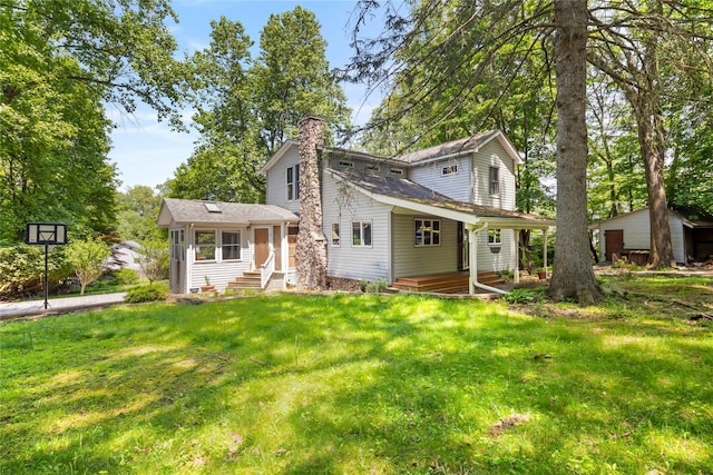 19 Farview Ter, Airmont, NY 10901 - view of front of house with a chimney, entry steps, and a front lawn
