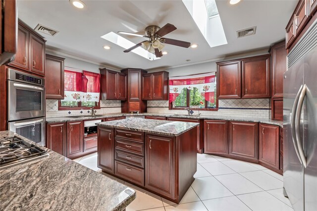 19 Farview Ter, Airmont, NY 10901 - kitchen with a skylight, appliances with stainless steel finishes, tasteful backsplash, ceiling fan, and recessed lighting