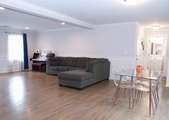 8 W Narcissus Rd, Mastic Beach, NY 11951 - living area featuring a decorative wall, wood finished floors, wainscoting, crown molding, and beam ceiling
