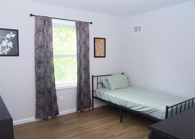 8 W Narcissus Rd, Mastic Beach, NY 11951 - bedroom featuring wood finished floors and baseboards