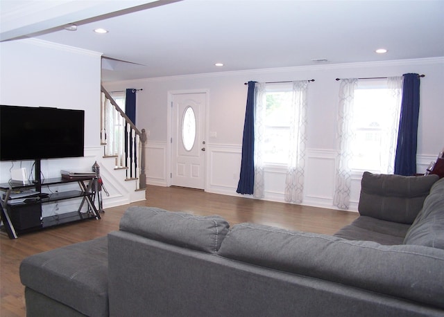 8 W Narcissus Rd, Mastic Beach, NY 11951 - living room with stairway, ornamental molding, a decorative wall, wood finished floors, and wainscoting